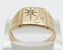 A 9ct gold signet ring set with a diamond in a star setting, 5.4g, size T