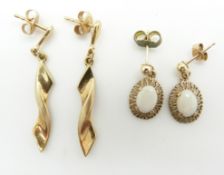 A pair of yellow metal earrings and a pair of 9ct gold earrings set with opals