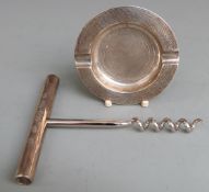 Feature hallmarked silver handled corkscrews and a hallmarked silver ashtray, Birmingham 1953,
