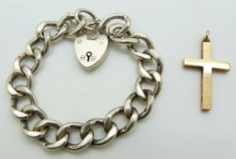 A 9ct gold cross pendant and a silver curb link bracelet