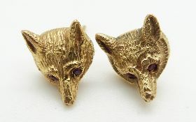 A pair of 9ct gold earrings in the form of fox's heads set with ruby eyes, 4.5g