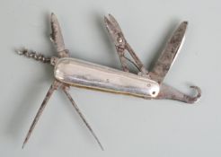 Miniature or salesman's vintage multi tool penknife with 7 blades and white metal sides,  length 4.