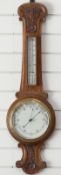 A carved oak aneroid barometer, 90cm tall