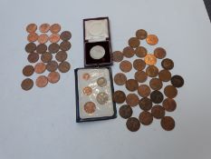 An amateur coin collection including tubes of mint uncirculated examples, booklets etc