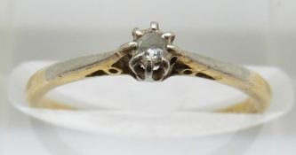 An 18ct gold ring set with a diamond in a platinum setting, in Cheltenham box, 1.5g, size J