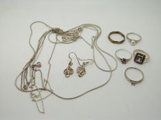 Silver chains, silver rings and a pair of earrings
