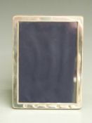 Millennium feature hallmarked silver photograph frame to suit 7x5 inch photo, with easel back