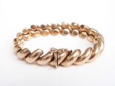 A 9ct gold bracelet made up of diagonal links, 28.1g