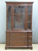 Glazed bookcase with break front three drawer base H182 x W104 x D42cm