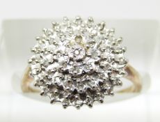 A 9ct gold ring set with diamonds in a cluster, 2.6g, size L