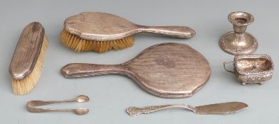 Quantity of silver items including embossed mustard, Birmingham 1910, sugar tongs and knife marked