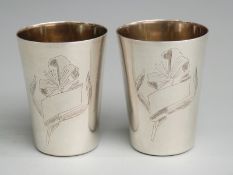 Pair of Russian white metal shot cups with 875 Russian silver marks and maker's name to base, height