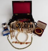 A collection of costume jewellery to include jet necklaces, Sarah Coventry bracelet, necklaces, a