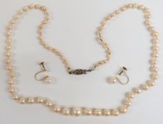 Pearl necklace with 9ct gold and diamond clasp, together with a pair of pearl and gold earrings