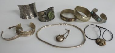 Seven various bangles, two necklaces and a scent bottle