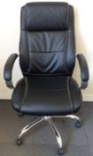 A leather office swivel chair raised on chrome base.