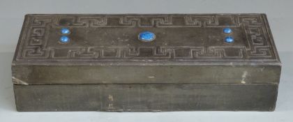 Arts and Crafts pewter box in the manner of Archibald Knox set with five blue cabochons, length