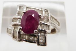 A 14k white gold ring set with a ruby and diamonds, total diamond weight approximately 0.32ct, 4.9g,