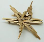 Ivan Tarratt 9ct gold brooch by Ernest A Blyth in a geometric star design, Birmingham 1972, 5.2 x