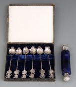 A 19thC / 20thC double ended scent bottle, the facet-cut blue glass bottle set with white metal