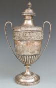 Victorian hallmarked silver pedestal twin handled trophy cup with repoussé decorated borders,