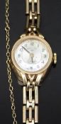 Rotary 9ct gold ladies wristwatch with black hands and Arabic numerals, two-tone silver and cream