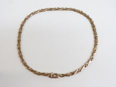 A 9ct gold necklace made up of cross links, 19.1g