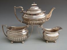 George V Walker and Hall hallmarked silver three piece teaset with reeded lower body and raised on