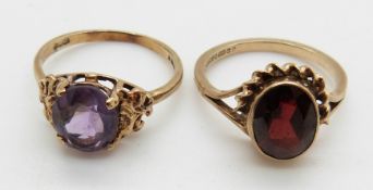 A 9ct gold ring set with an oval amethyst and a 9ct gold ring set with an oval garnet, 4.6g