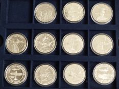 History of the R.A.F silver £5 and $5 coin collection comprising 11 silver crown sized coins in a
