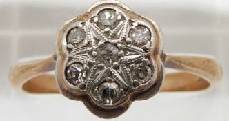 A 9ct gold ring set with diamonds in a platinum setting, 2.8g, size R