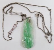 Art Deco white metal necklace set with a carved jadeite plaque, 3.5cm long