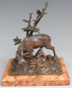 Late 19th or early 20thC bronze figure of a deer and fawn beneath a tree, raised on a bevelled