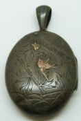 Victorian white metal locket with engraved bamboo and applied gold bird and insect decoration