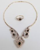 A 14ct gold necklace set with sapphires and cubic zirconia, and a matching ring