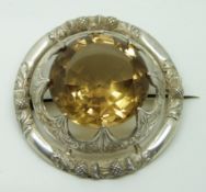 Victorian silver brooch/plaid set with a large citrine (Caingorm) within a thistle decorated border,