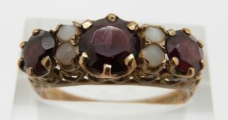 A 9ct gold garnet and pearl ring, 3g, size R