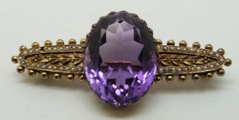 Edwardian 15ct gold brooch set with a large oval cut amethyst and seed pearls, 4.7g long