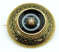 Victorian brooch set with black enamel and banded agate with a central pearl, within a rope twist