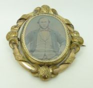 Victorian pinchbeck swivel mourning brooch set with a daguerreotype, verso plaited hair, 5.8 x 5.