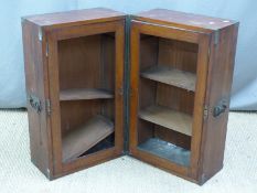 19thC mahogany campaign bookcase with brass protective fittings and steel handles, opening to reveal
