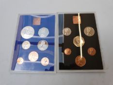 Four Royal Mint brilliant uncirculated coin sets comprising three 1979 examples and a Silver Jubilee