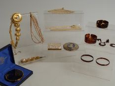 A collection of costume jewellery including Sphinx necklace, Stratton Wedgwood compact, white