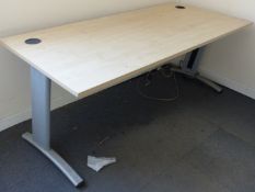 A beech office desk raised on metal legs, 180x80cm.