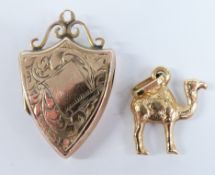 Victorian 9ct gold back and front shield shaped locket and an 18ct gold camel charm, 1.6g