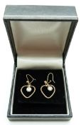 Pair of bespoke 9ct gold earrings each set with a diamond of approximately 0.4ct  in a heart