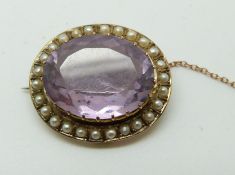 Edwardian 9ct gold brooch set with an oval cut amethyst and seed pearls (2.5 x 2cm)