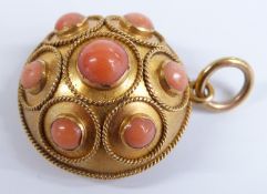 Victorian mourning pendant set with coral cabochons within rope twist borders, verso a glass