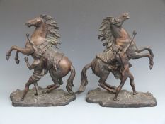Pair of bronze Marley horses after Coustou, signed to bases, height 45cm