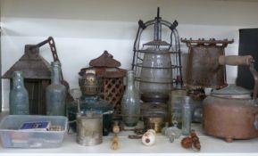 Quantity of oil lamps and heaters including one marked 1942, Worcester interest bottles G.H. Gray,